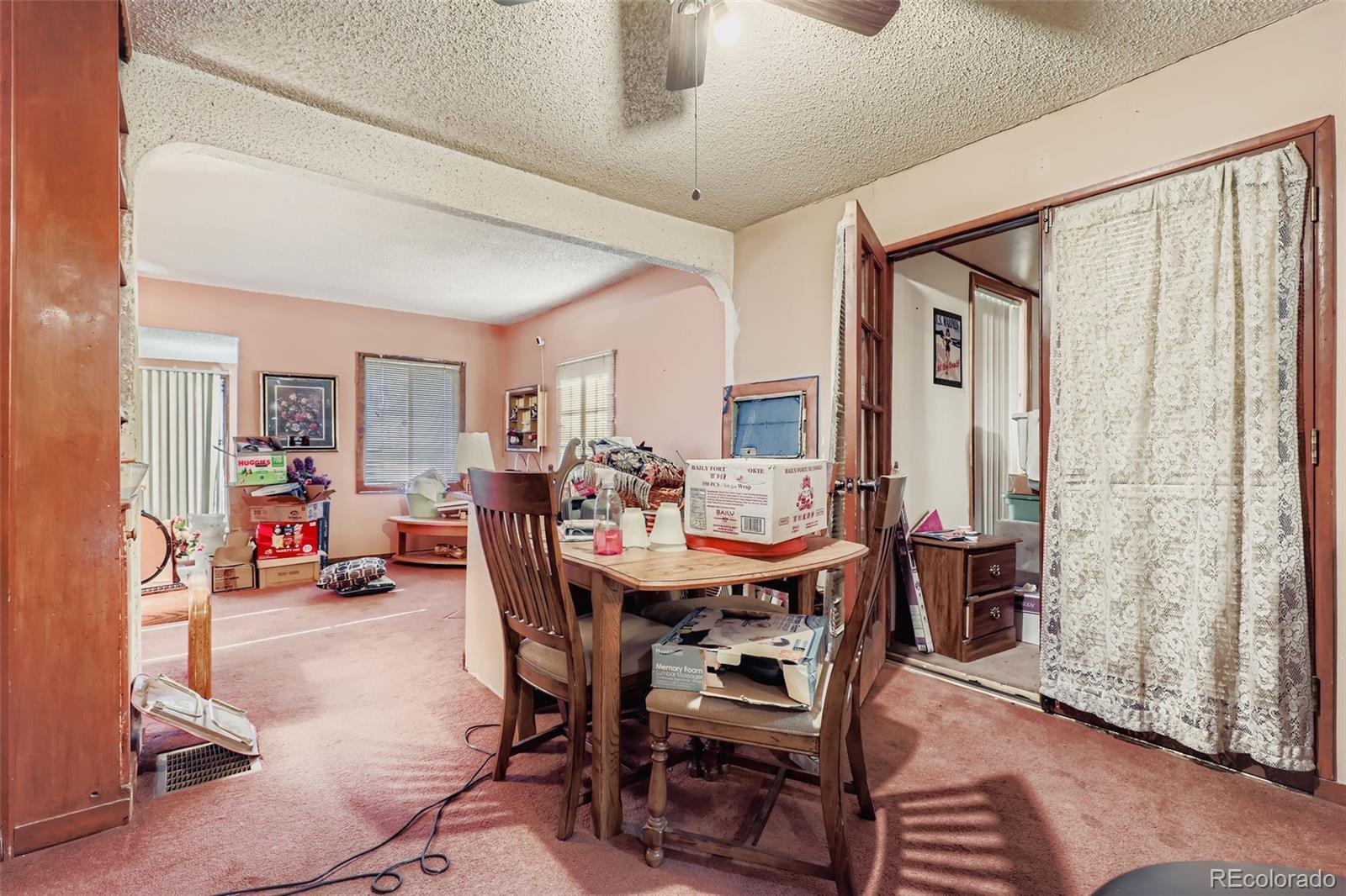657 Meade Street Denver, CO 80204 - Photo 5 of 17 a view of a livingroom with furniture and a window