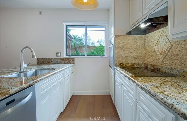 a view of a kitchen with furniture and a kitchen