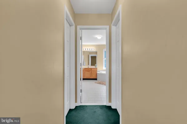 a view of a bedroom from a hallway