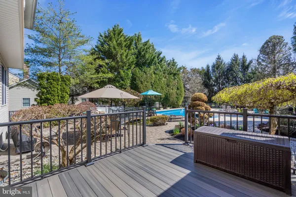 a balcony with wooden floor outdoor seating