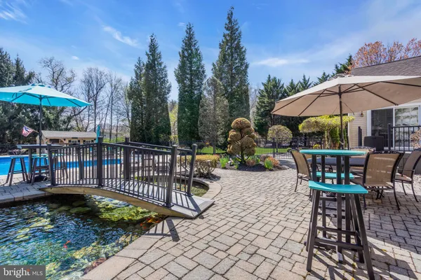 a view of a chair and tables in the patio
