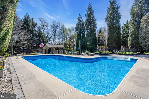 a view of swimming pool with outdoor seating