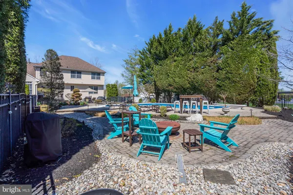 a view of a lounge chairs in a backyard