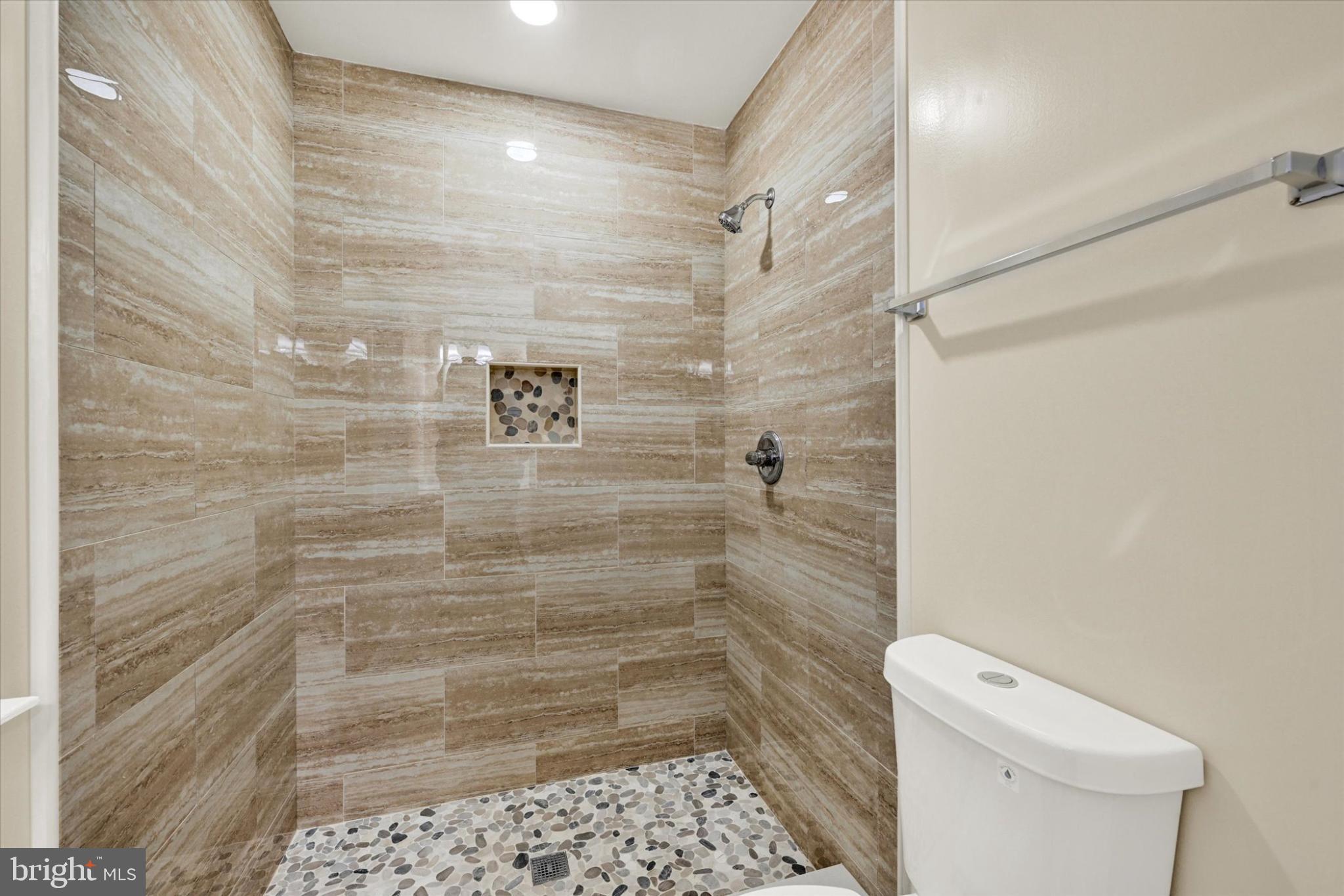22 Cockeys Mill Road Reisterstown, MD 21136 - Photo 15 of 27 Elegant shower space with marble tiles.