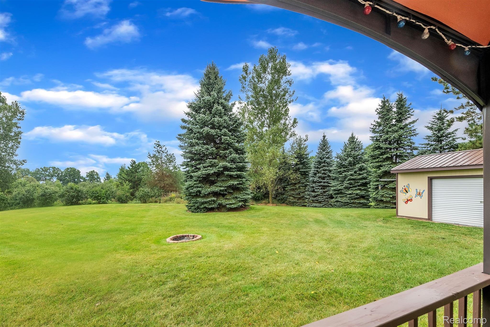 3876 Innisfree Road Howell, MI 48855 - Photo 23 of 31 Fire Pit for Cool Fall Evenings