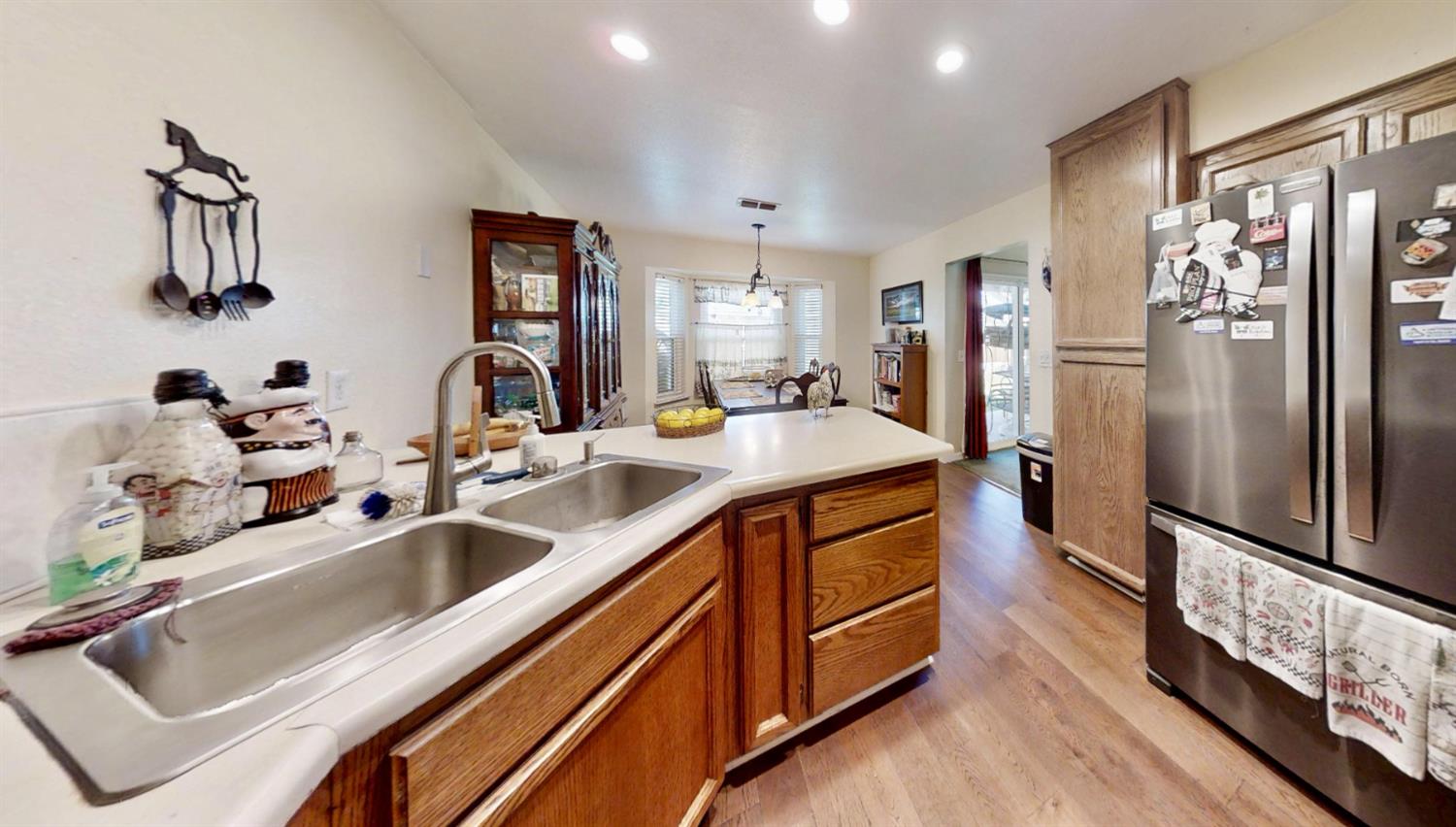 5161 Thomasino Way Antelope, CA 95843 - Photo 12 of 41 a kitchen with stainless steel appliances a sink and refrigerator