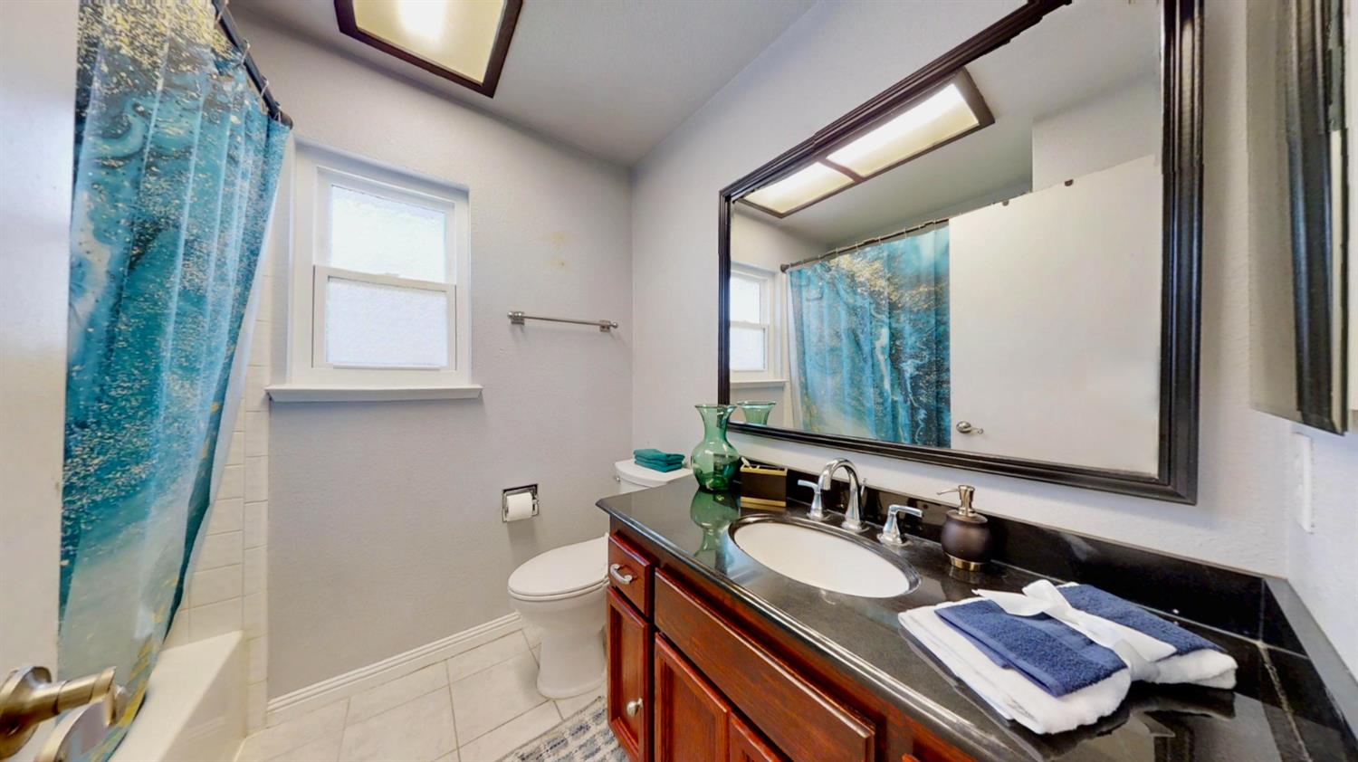 5161 Thomasino Way Antelope, CA 95843 - Photo 30 of 41 a bathroom with a sink and a mirror