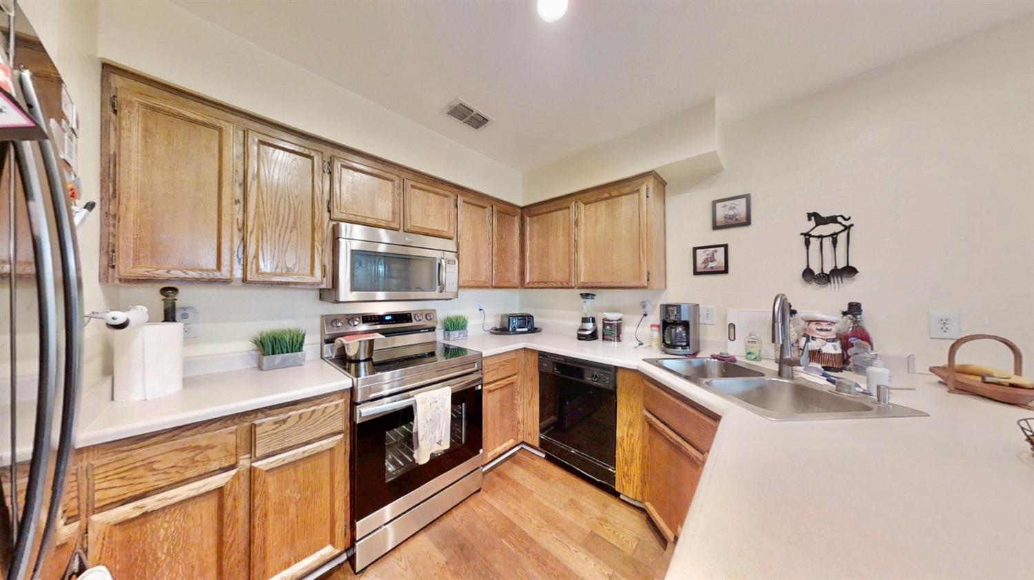 5161 Thomasino Way Antelope, CA 95843 - Photo 10 of 41 a kitchen with stainless steel appliances granite countertop a sink stove and refrigerator