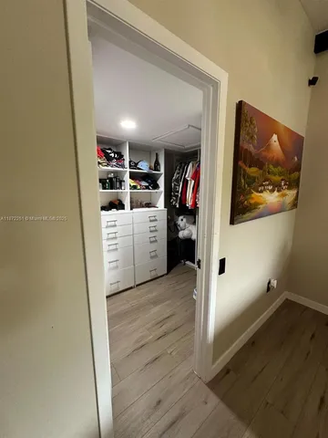 a view of a kitchen with storage and utility