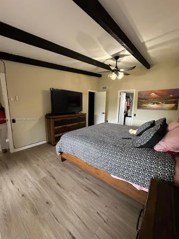 a living room with a flat screen tv and a fireplace