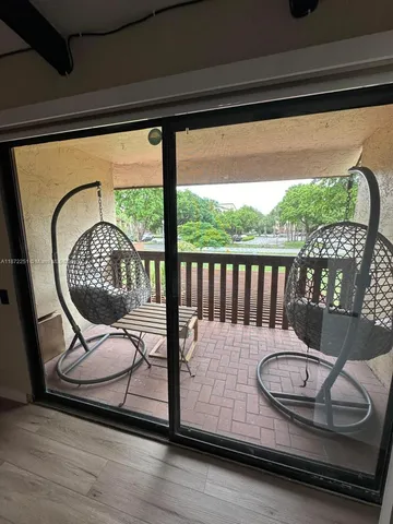 a view of a porch with furniture
