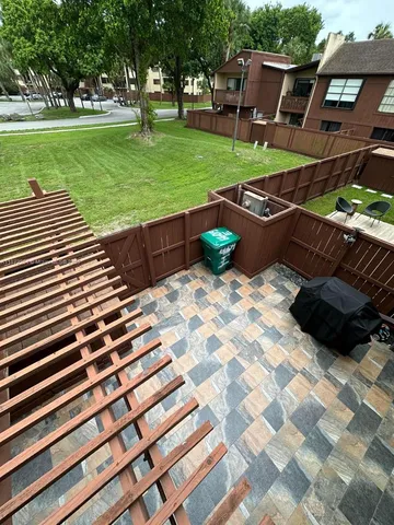 a view of a backyard with sitting area