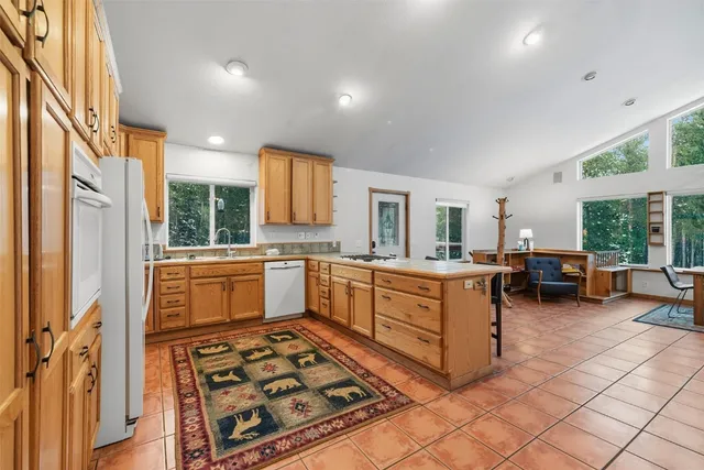 a kitchen with sink cabinets and window