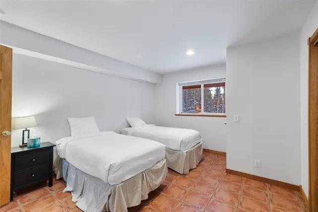 a bedroom with a large bed and a closet