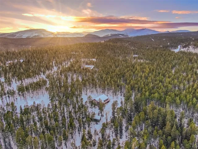 a view of a sign in front of houses