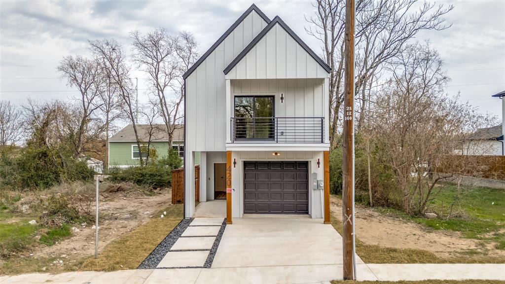 420 Sparks Street Dallas, TX 75203 - Photo 1 of 12 a front view of a house with garden