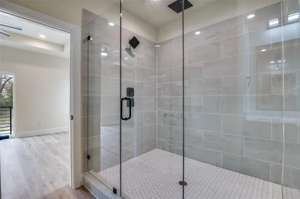a bathroom with a shower and a sink