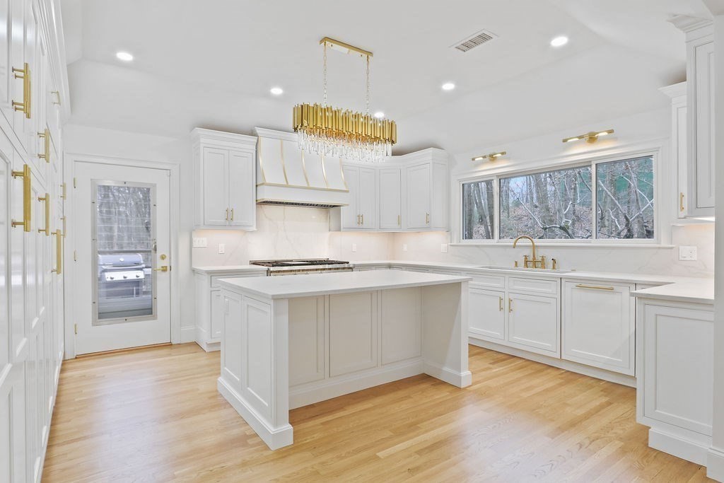 80 Doublet Hill Road Weston, MA 02493 - Photo 11 of 38 a kitchen with stainless steel appliances granite countertop a sink and cabinets
