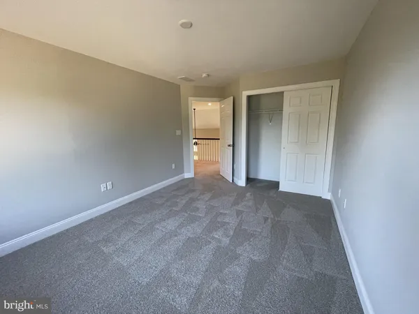 a view of an empty room and a window