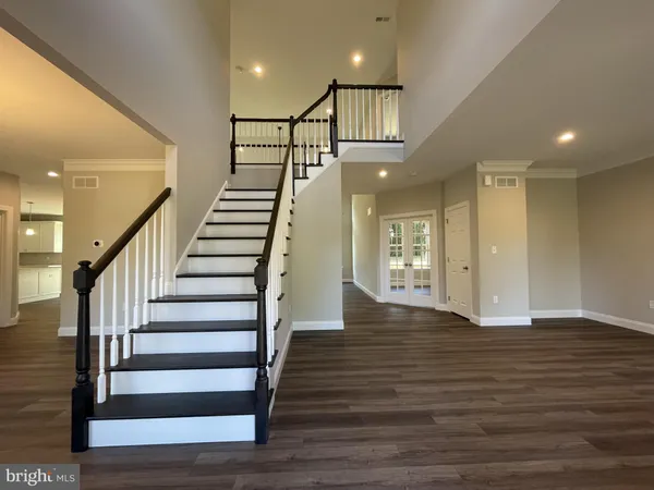 a view of an entryway with wooden floor