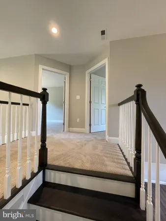 a view of bedroom with wooden floor