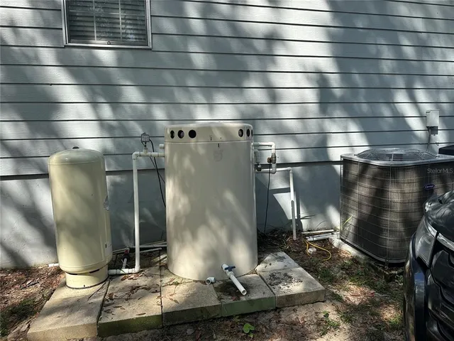 a view of a backyard with large trees