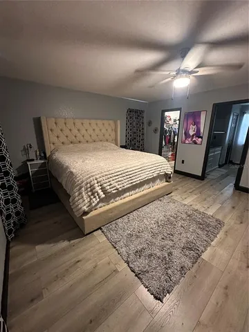 a view of walk in closet with clothes