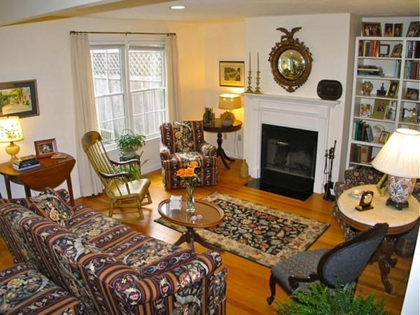 256 Sandpiper Lane Tisbury, MA 02568 - Photo 1 of 25 a living room with furniture and a fireplace