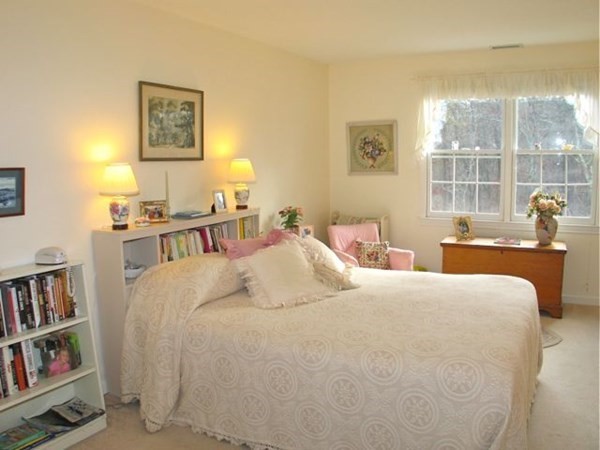 256 Sandpiper Lane Tisbury, MA 02568 - Photo 11 of 25 a bedroom with a bed furniture and a book shelf
