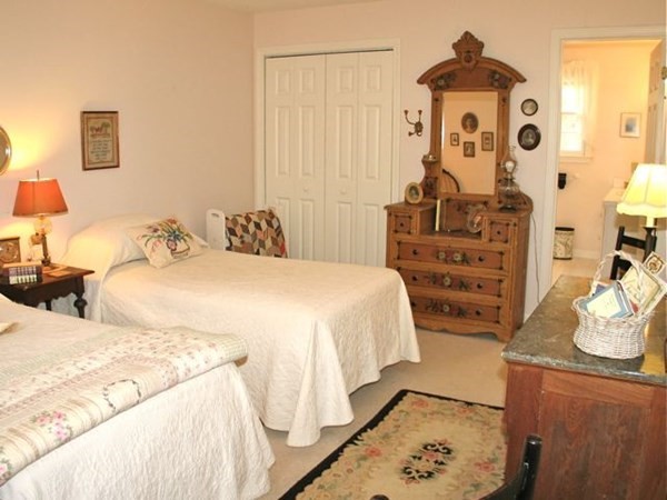 256 Sandpiper Lane Tisbury, MA 02568 - Photo 14 of 25 a bedroom with bed and cabinets