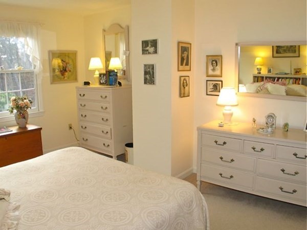 256 Sandpiper Lane Tisbury, MA 02568 - Photo 16 of 25 a bedroom with a bed and a dresser in it