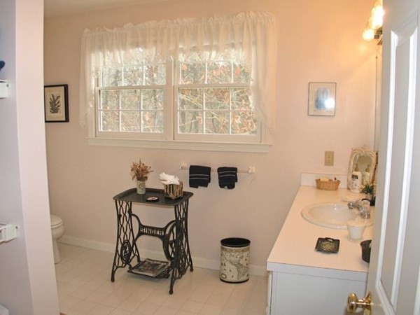 256 Sandpiper Lane Tisbury, MA 02568 - Photo 17 of 25 a bathroom with a sink and a window