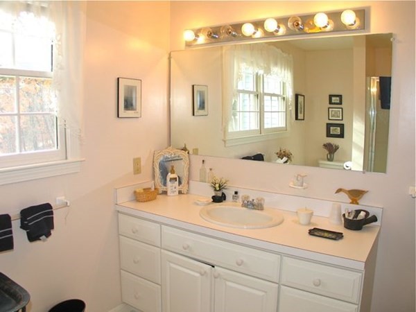 256 Sandpiper Lane Tisbury, MA 02568 - Photo 18 of 25 a bathroom with a sink and a mirror