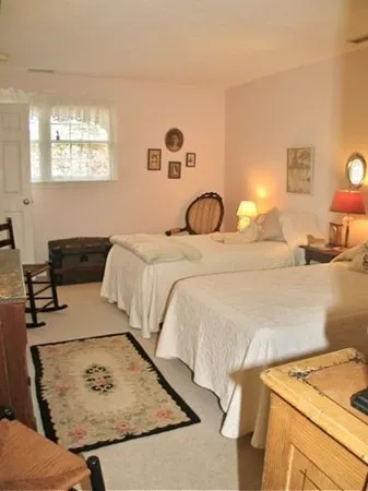 a spacious bathroom with a sink and a mirror