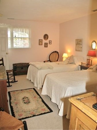 256 Sandpiper Lane Tisbury, MA 02568 - Photo 20 of 25 a bedroom with a bed and a dresser