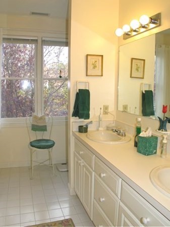 256 Sandpiper Lane Tisbury, MA 02568 - Photo 21 of 25 a spacious bathroom with a sink and a mirror