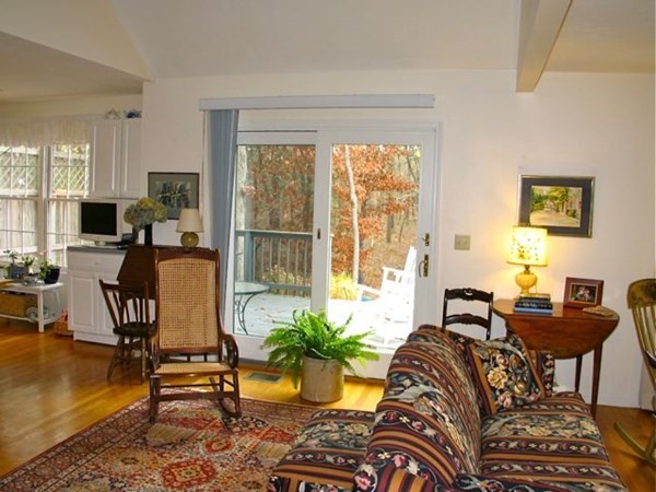 256 Sandpiper Lane Tisbury, MA 02568 - Photo 4 of 25 a living room with furniture and a floor to ceiling window