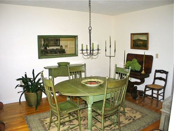 256 Sandpiper Lane Tisbury, MA 02568 - Photo 8 of 25 a dining room with furniture and wooden floor