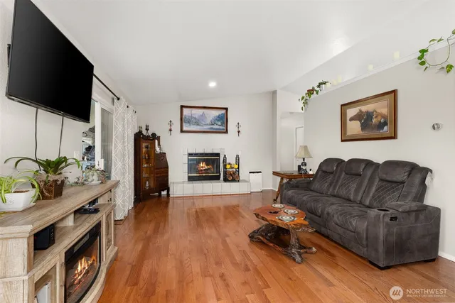 a living room with furniture and a flat screen tv