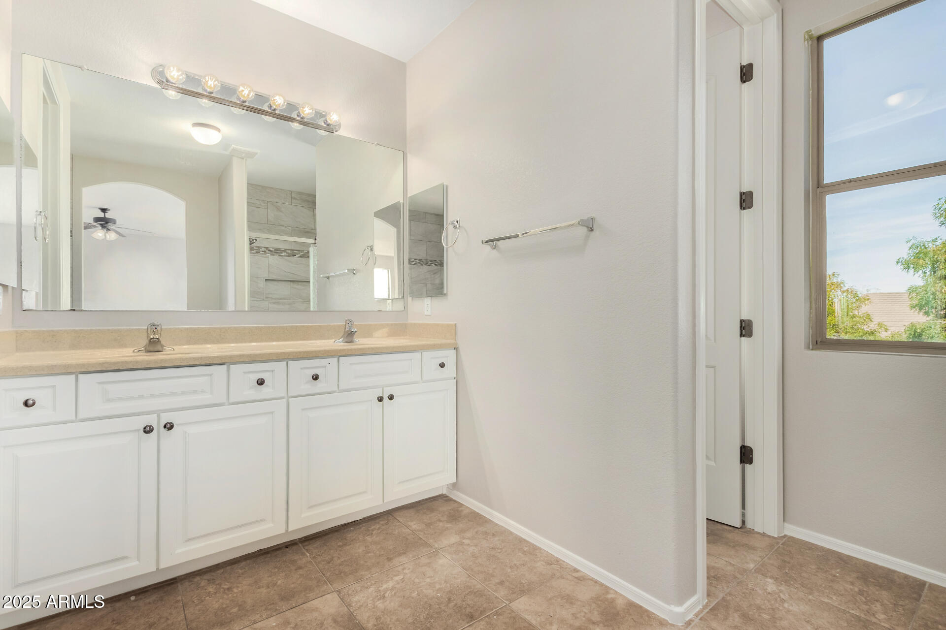 1036 East Oak Road San Tan Valley, AZ 85140 - Photo 15 of 37 a bathroom with a granite countertop sink and a mirror