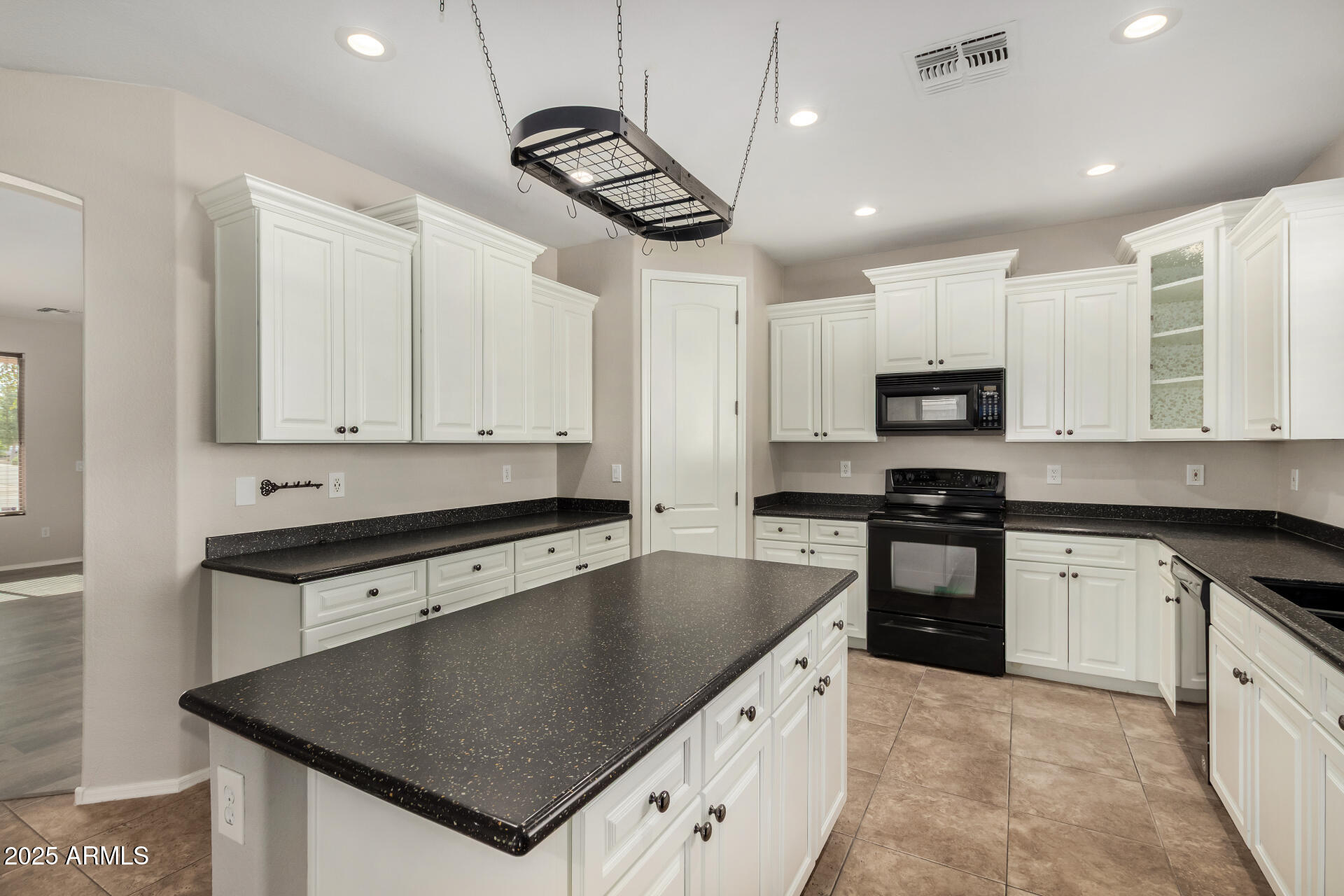 1036 East Oak Road San Tan Valley, AZ 85140 - Photo 19 of 37 a kitchen with stainless steel appliances granite countertop a sink a stove and cabinets