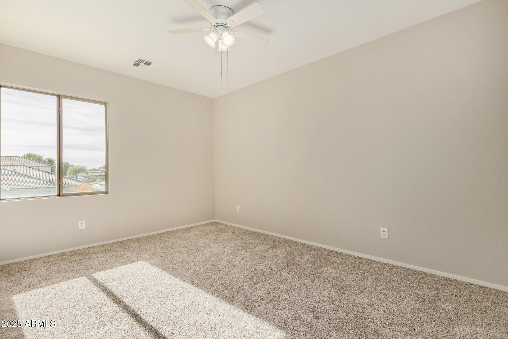 1036 East Oak Road San Tan Valley, AZ 85140 - Photo 30 of 37 an empty room with a window