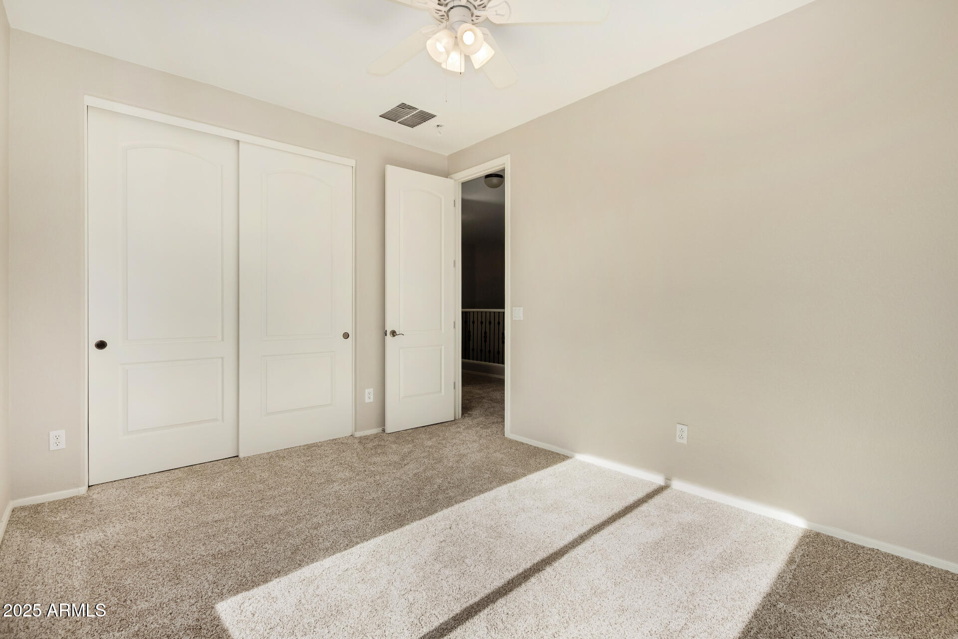 1036 East Oak Road San Tan Valley, AZ 85140 - Photo 35 of 37 an empty room with a ceiling fan