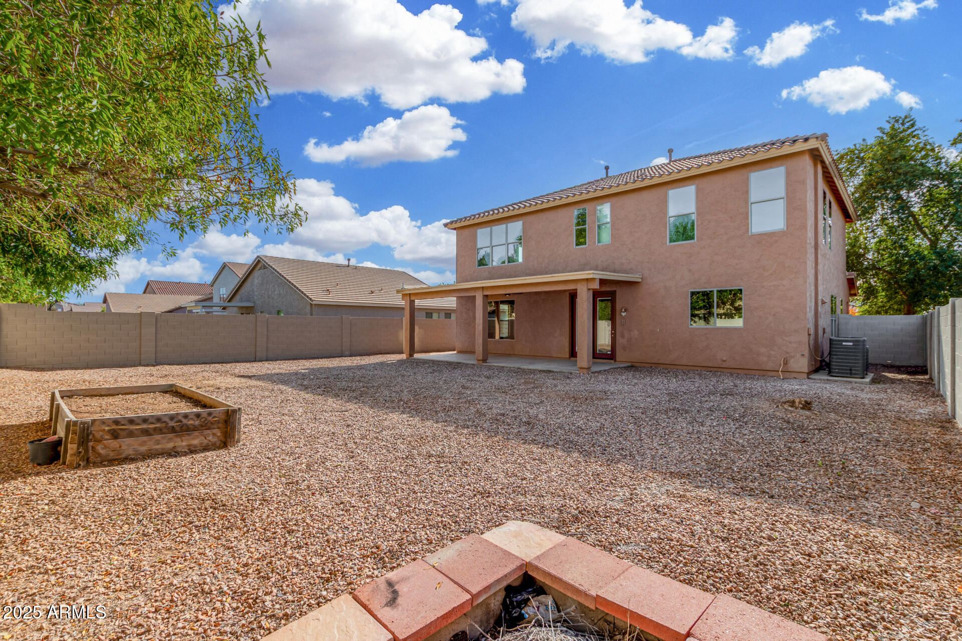 1036 East Oak Road San Tan Valley, AZ 85140 - Photo 36 of 37 a view of a house with a backyard