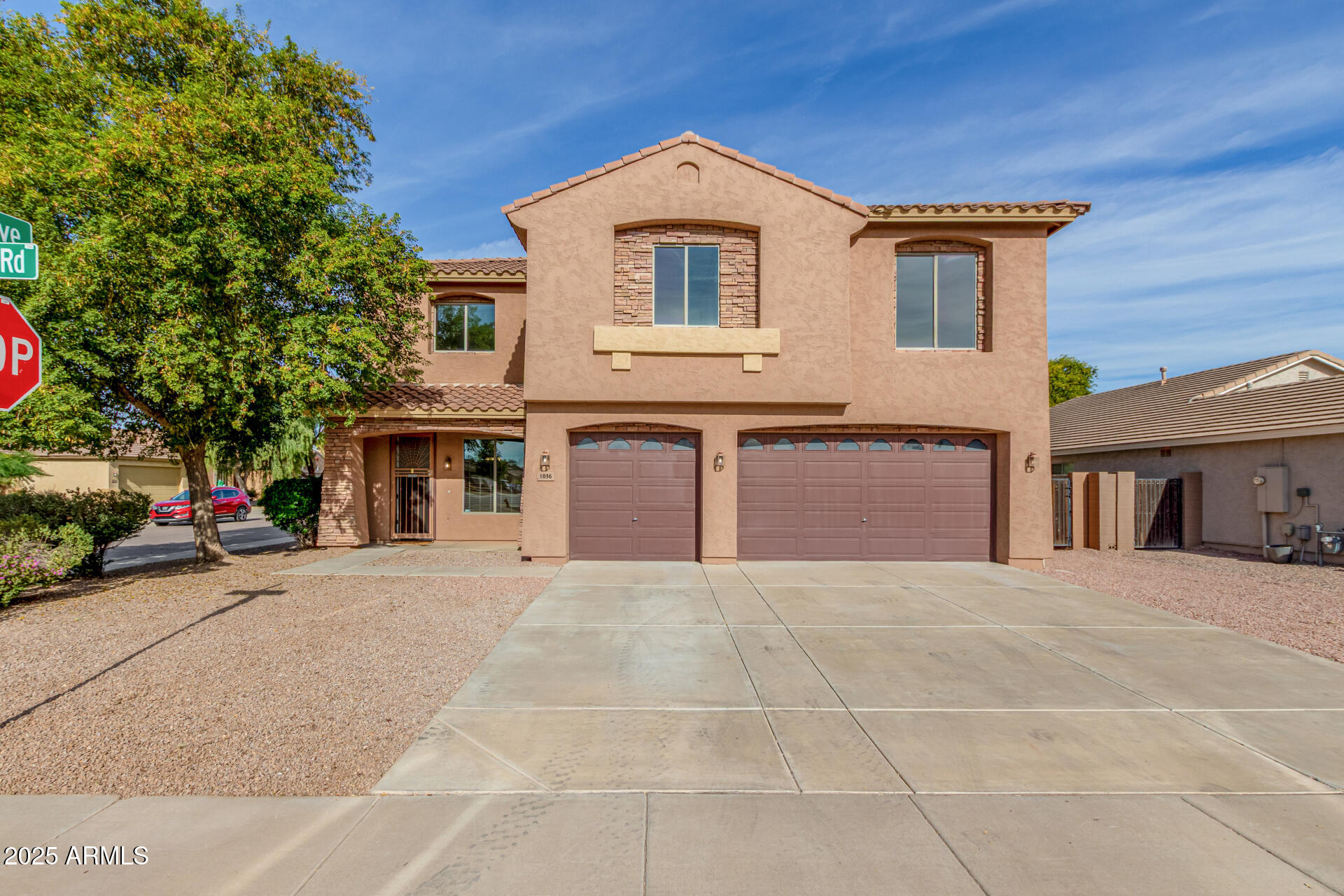 1036 East Oak Road San Tan Valley, AZ 85140 - Photo 37 of 37 a front view of a house with a yard and garage