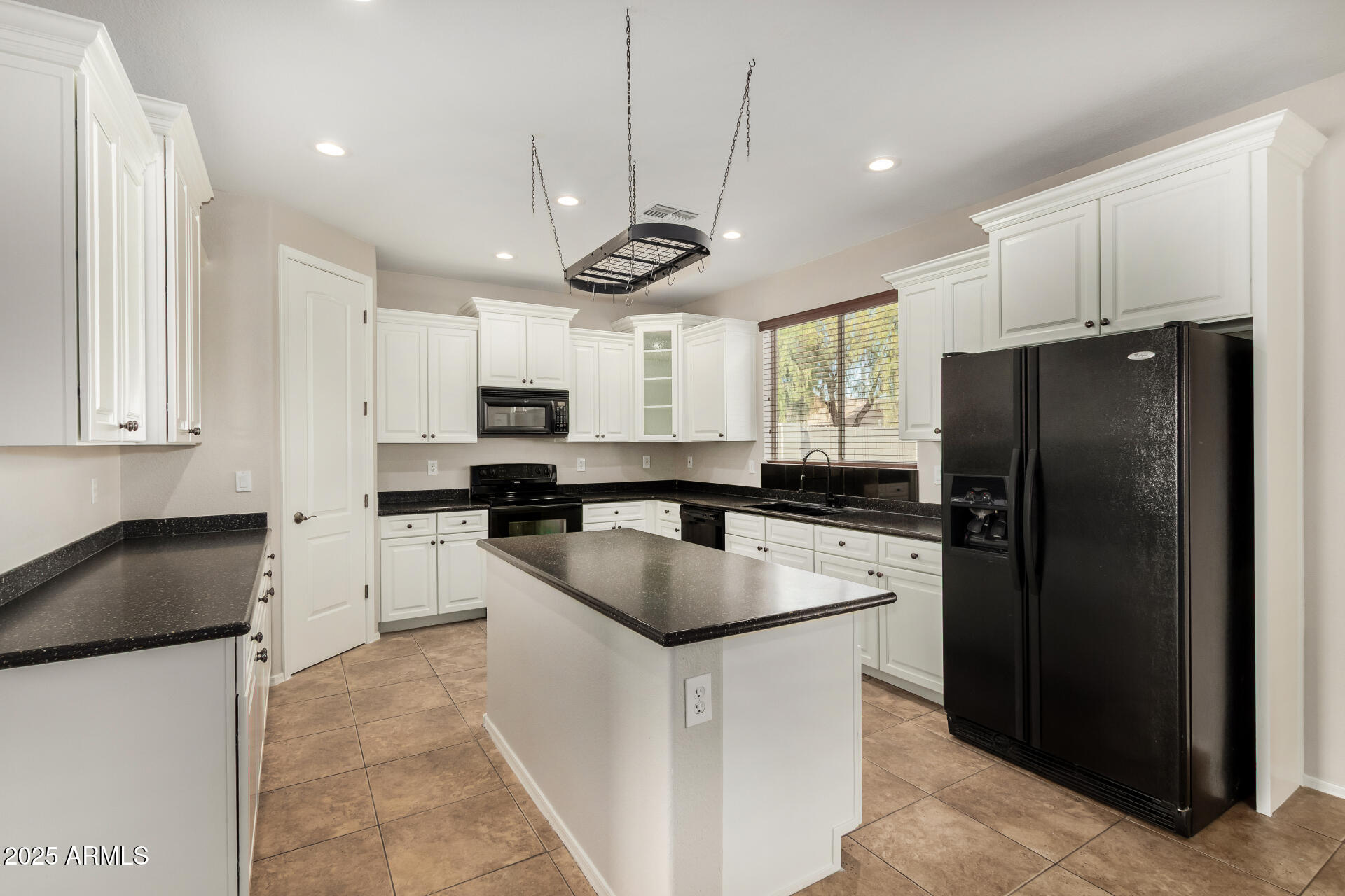 1036 East Oak Road San Tan Valley, AZ 85140 - Photo 4 of 37 a kitchen with stainless steel appliances granite countertop a refrigerator a sink dishwasher a stove and a refrigerator