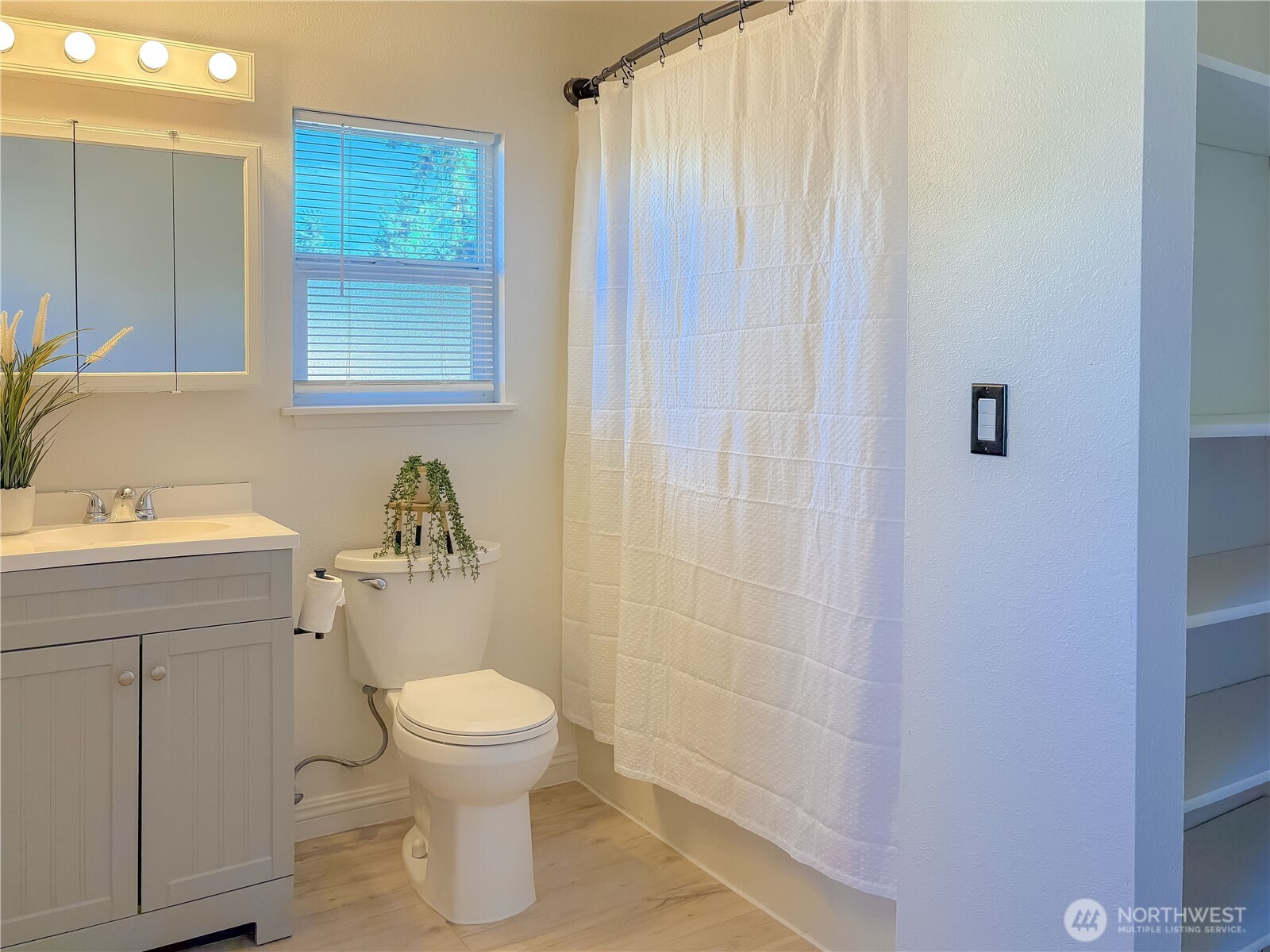 301 Seattle Street East Rainier, WA 98576 - Photo 14 of 18 a bathroom with a toilet a sink and a mirror