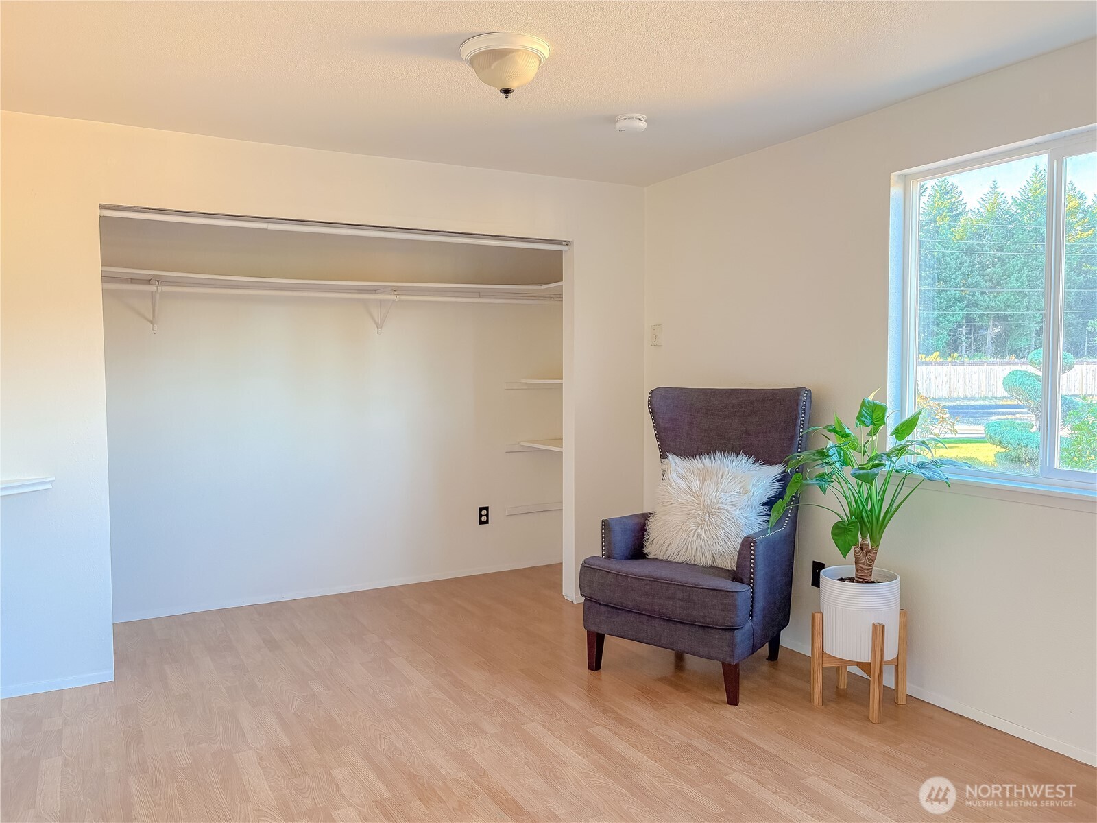 301 Seattle Street East Rainier, WA 98576 - Photo 15 of 18 a room with furniture and a potted plant