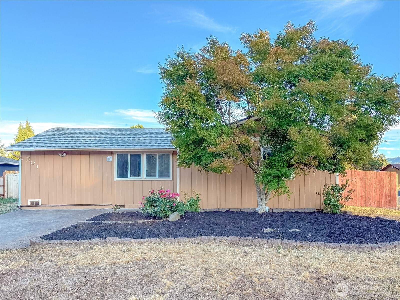 301 Seattle Street East Rainier, WA 98576 - Photo 2 of 18 a front view of a house with a yard