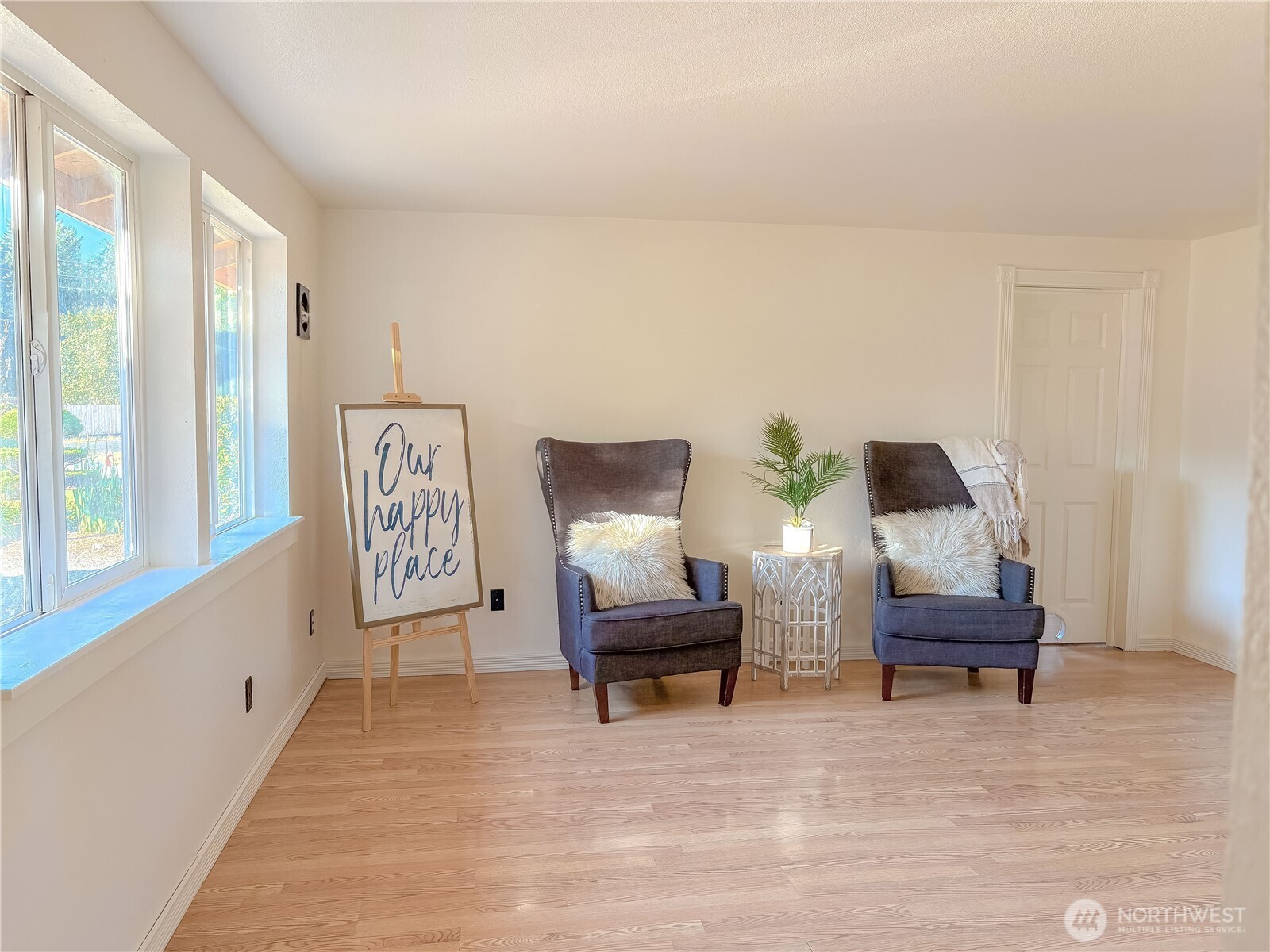 301 Seattle Street East Rainier, WA 98576 - Photo 4 of 18 a living room with furniture and a large window